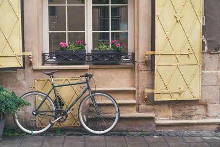 Old bicycle stands under the windows of the hotel in downtown Lvivの写真素材