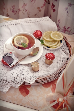 Cup of tea on a pillowの写真素材