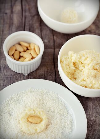 Homemade candies with coconut on wooden tableの写真素材