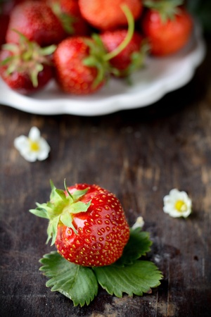 plate with strawberry on table, rustic styleの写真素材