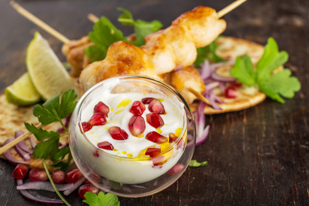 sauce chicken kebabs with pomegranate seeds の写真素材