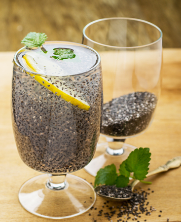 Chia seeds drink with water in transparent glass with lime and lemon balm. selective Focusの写真素材