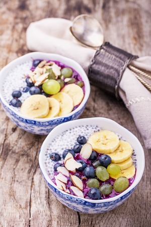 Breakfast smoothie bowl with fruits and granola. Selective focusの写真素材