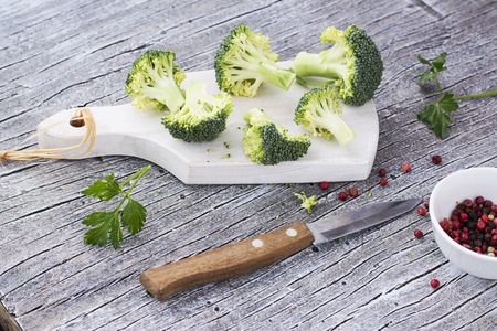 freshly halved green broccoli served on the wooden cutting board. Selective focusの写真素材