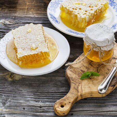 Honey and honeycomb with jasmine  copyspaceの写真素材