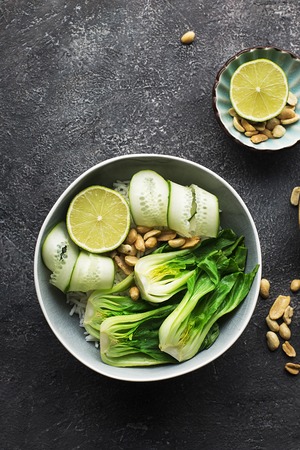 Rice boc choy lime cucumber vegetarian bowl for a healthy diet. Top Viewの写真素材