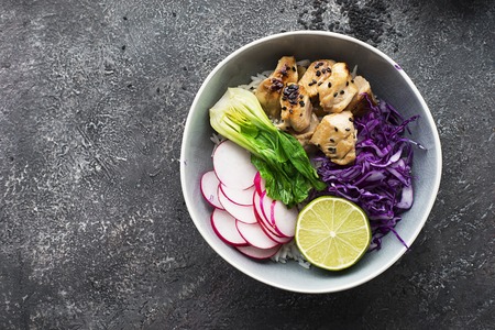 Teriyaki chicken breast, rice, bok choy, radish, cucumber, red cabbage bowl. Top View.の写真素材