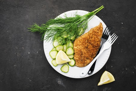 Chicken Milanese with vegetable, In white dish