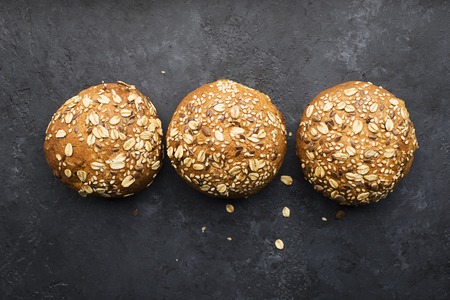 Wholegrain burger buns on darkの写真素材