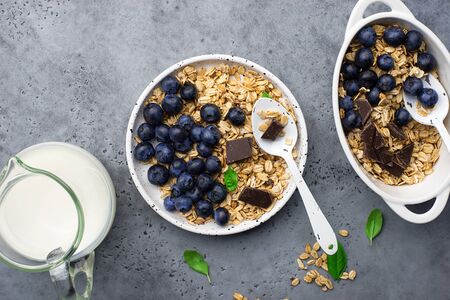 Healthy balanced breakfast. Whole grain caramel granola, fresh organic blueberries. Minimalism.の写真素材