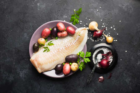 A fish dish. Ingredients. Cod and potatoes.の写真素材