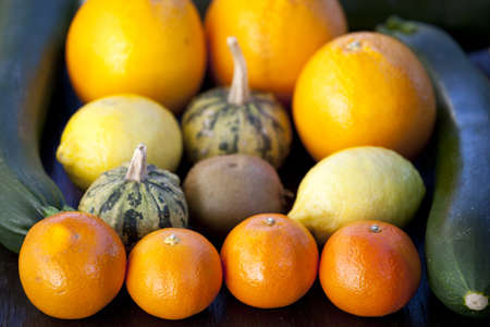 Group of fresh fruits  mandarines, tangerines, clementines, lemons and vegetables  broccoli,...