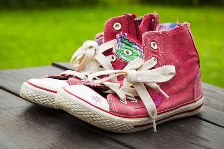 Pair of red school sneakers の写真素材