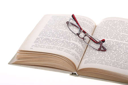 Reading concept. Glasses lying on a book.のeditorial素材