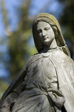 Old cemetery angel sculpture made of stoneの写真素材