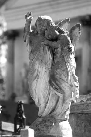 Old cemetery angel sculpture made of stoneの写真素材