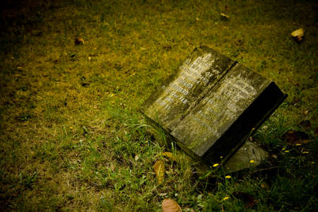 Old cemetery angel sculpture made of stoneの写真素材