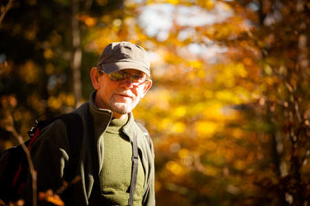Adult tourist portrait in autumn woods, photo taken in polish Beskidy mountains, Krawcow Wierchの写真素材