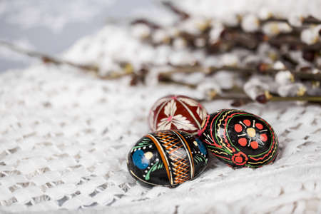 Happy Easter and spring concept colorful photo - beautiful old eggs and willow flowers