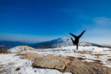 Winter yoga session in beautiful place - Beskid mountains, Poland. Babiagora National Parkの写真素材