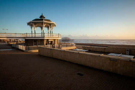 Sunset view on beautiful Brighton bandstand during sunny day, with blue skyの写真素材
