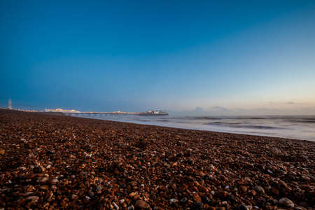 Dramatic view on Brighton pier during sunsetの写真素材