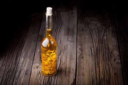 Homemade DIY natural infused olive oil with lemon peelの写真素材