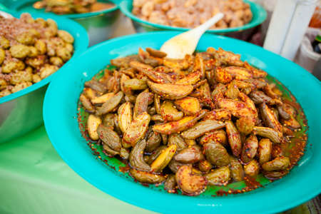 Selection of asian pickles prepared with chilli. Traditional thai cuisine on market.の写真素材