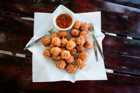 Fresh fried thai no name meatballs served with sweet chilli sauce. Traditional asian cuisine.の写真素材