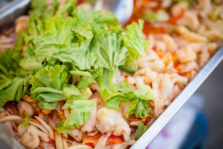 Fresh made asian stir fry. Traditional thai cuisine in big tray.の写真素材