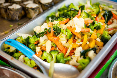 Fresh mix of carrot, brocolli, cauliflower and baby corn stir fry. Traditional thai cuisine.の写真素材