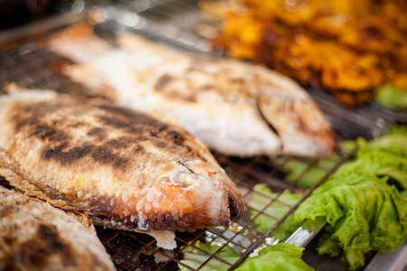 Fresh grilled whole red snapper fish in sea salt. Traditional thai cuisine.の写真素材