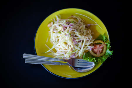 Fresh made squid barbeque skewer in hand. Traditional thai cuisine.の写真素材