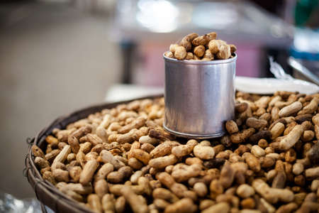 Fresh roasted peanuts. Traditional thai snack.の写真素材
