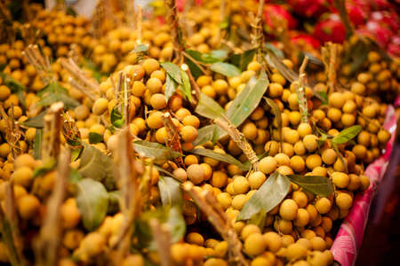 Fresh longan fruits. Traditional thai market.
