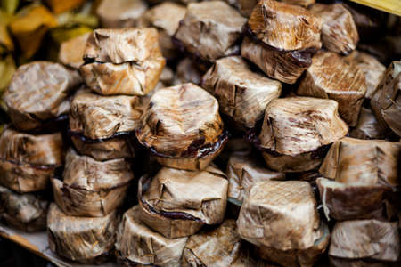 Fresh made thai Khanom tako made with coconut milk. Traditional thai dessert served in banana leaf.