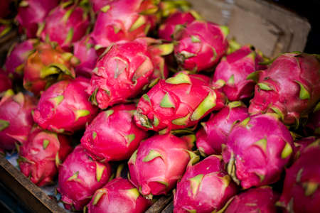 Selection of fresh dragon fruits. Traditional thai market.の写真素材