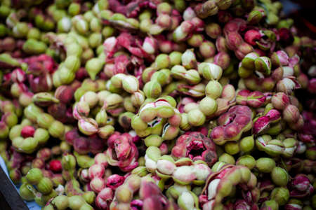 Selection of fresh tamarind fruits. Traditional thai market.の写真素材