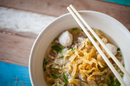 Fresh made thai noodle soup served with meatballs and sprouts. Traditional thai cuisine.の写真素材