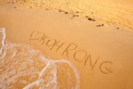 Name of Cambodian island Koh Rong signed on beach. South east Asia symbols.の写真素材