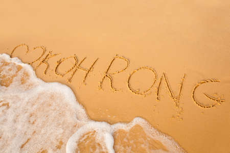 Name of Cambodian island Koh Rong signed on beach. South east Asia symbols.の写真素材