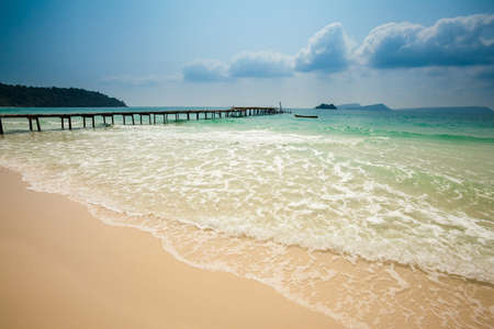 Summer seascape on tropical island Koh Rong in Cambodia. Landscape of south east Asia with wooden pier.の写真素材