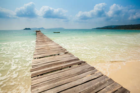 Summer seascape on tropical island Koh Rong in Cambodia. Landscape of south east Asia with wooden pier.の写真素材