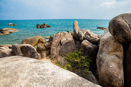 Summer seascape on tropical island Koh Samui in Thailand. Famous grandfather rock.の写真素材