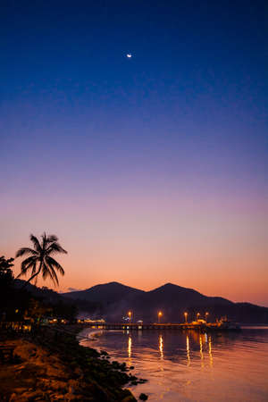 Beautiful sunset on tropical island Koh Phangan in Thailand. Chalokum beach landscape.の写真素材