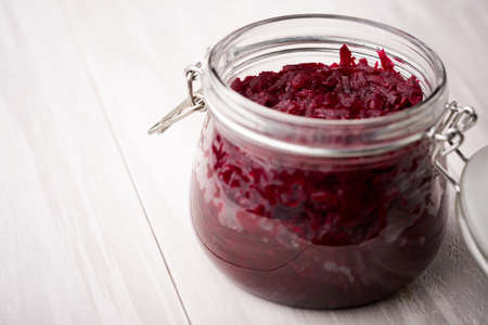 Homemade DIY natural healthy sweet and sour pickled beetroot in glass jar on a wooden tableの写真素材