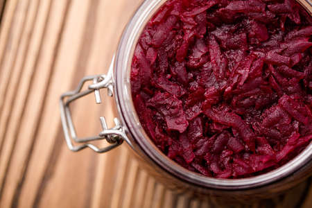 Homemade DIY natural healthy sweet and sour pickled beetroot in glass jar on a wooden tableの写真素材