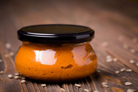 Homemade DIY natural vegan very healthy red sunflower seeds mixed with roast pepper paste in a glass...