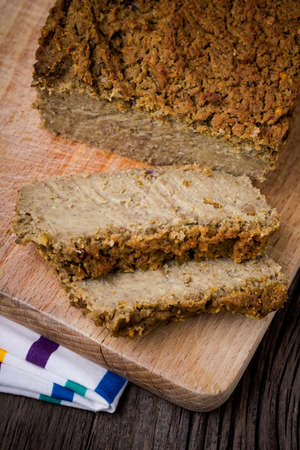 Homemade DIY natural tasty pate made of green lentil, millet groats, onion, and herbs