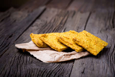 Homemade DIY natural vegan very healthy bread made of millet gruel on a wooden table
